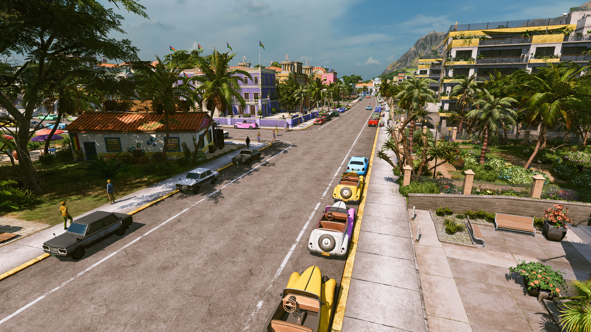 Captura oficial de Tropico 7 con una avenida y edificios de una ciudad tropical